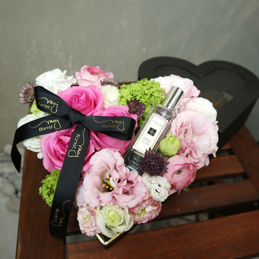 Mixed flowers with gift in a box